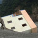 Image of Chief’s house upended in riverbed, disaster area, village south of Taitung, Taiwan, January 5, 2010 (© P.J. Stewart & A.J. Strathern Archive)