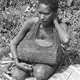 Mother with baby in netbag, near birth hut - Dei Council, Hagen, PNG, July-August 1969 - (© P.J. Stewart & A.J. Strathern Archive)