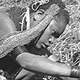 Woman tending her pig at a bridewealth event - Kawelka group, Hagen, PNG, July-August 1969 - (© P.J. Stewart & A.J. Strathern Archive)