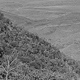 View of dirt road across valley landscape - Kawelka territory, Dei Council, Hagen, PNG, July-August 1969 - (© P.J. Stewart & A.J. Strathern Archive)